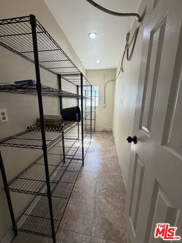 a bathroom with a shower and closet