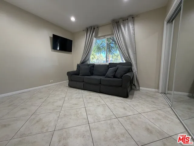 a view of an empty room and a window