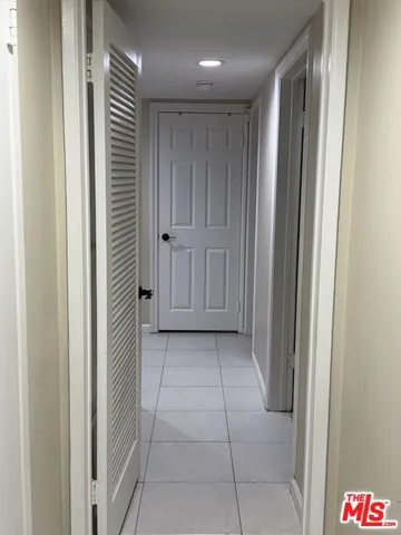 a lobby with furniture and window