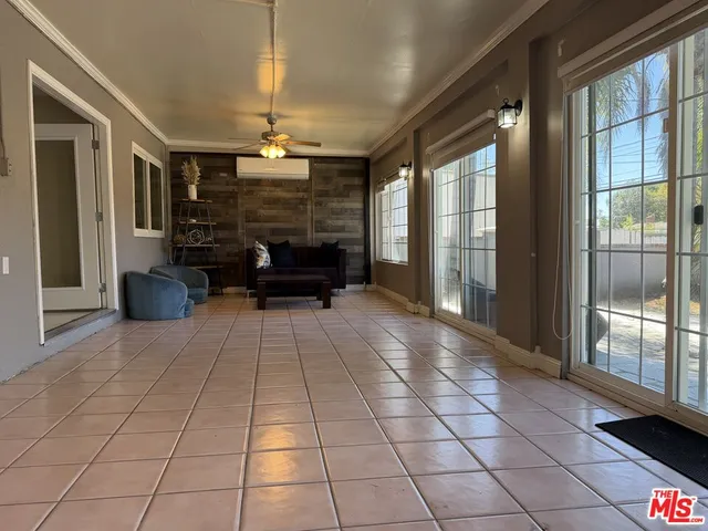 a lobby with furniture and window