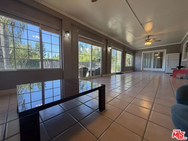a lobby with furniture and chandelier
