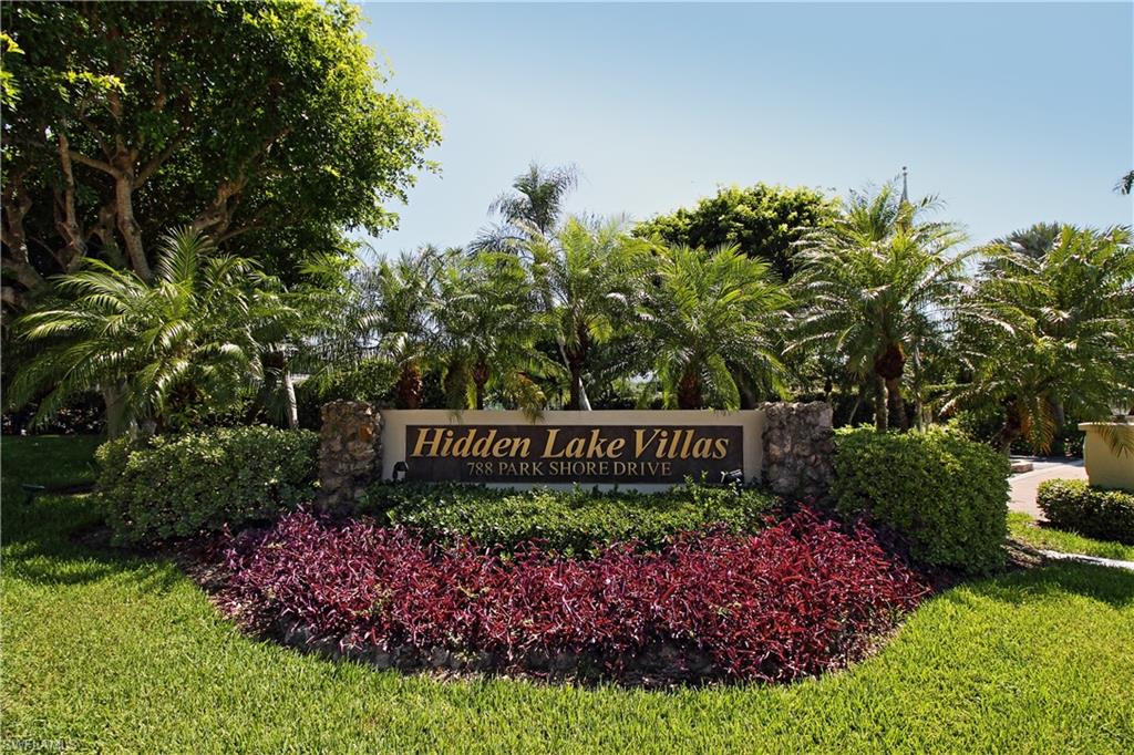 788 Park Shore Drive, Unit E20 Naples, FL 34103 - Photo 25 of 37 a view of sign board and green space