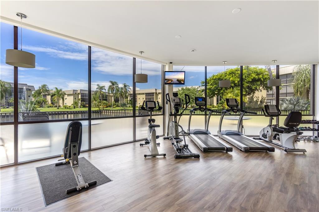 788 Park Shore Drive, Unit E20 Naples, FL 34103 - Photo 29 of 37 a view of a room with gym equipment
