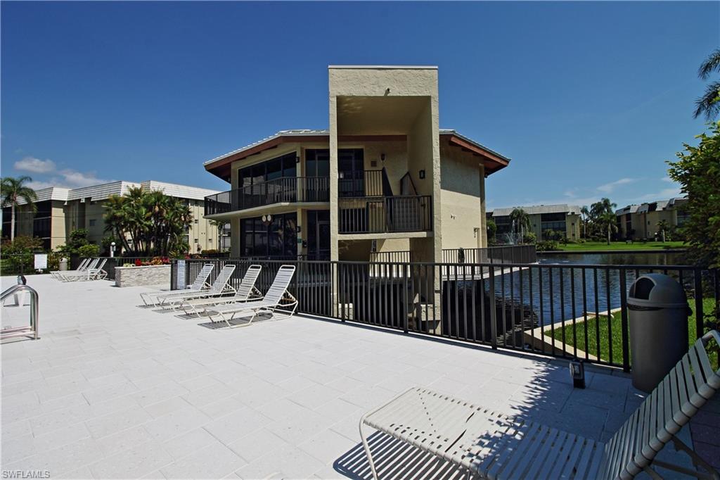 788 Park Shore Drive, Unit E20 Naples, FL 34103 - Photo 31 of 37 a view of a house with wooden deck