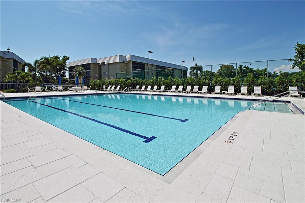 788 Park Shore Drive, Unit E20 Naples, FL 34103 - Photo 35 of 37 a view of a swimming pool and outdoor space