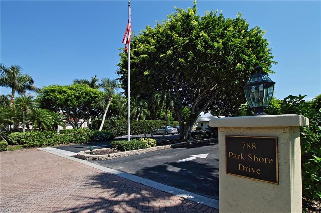 788 Park Shore Drive, Unit E20 Naples, FL 34103 - Photo 37 of 37 a view of a street with a tree