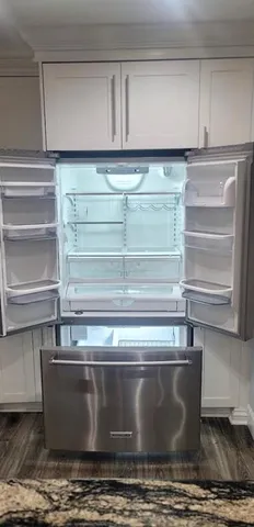 a view of a workspace with furniture and a bedroom