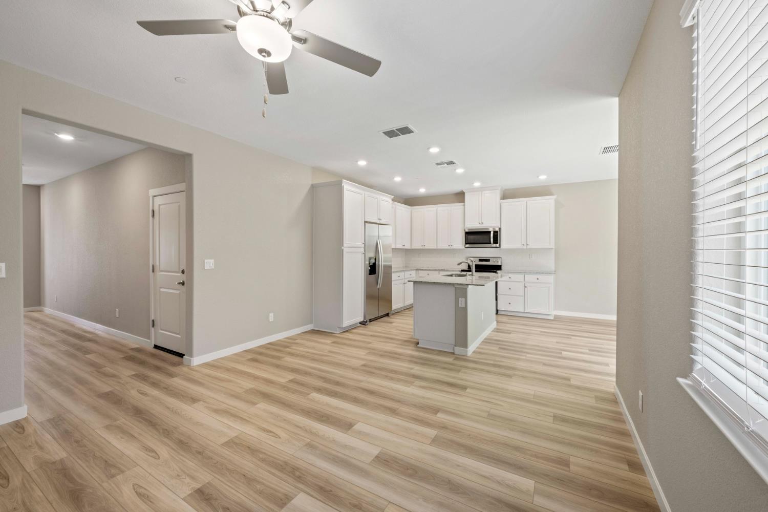 2578 Bog Street Lincoln, CA 95648 - Photo 4 of 19 a view of kitchen with refrigerator stove microwave and cabinets