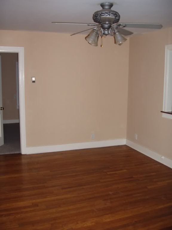 5204 Duval Street Austin, TX 78751 - Photo 2 of 7 a view of a room with wooden floor and fan
