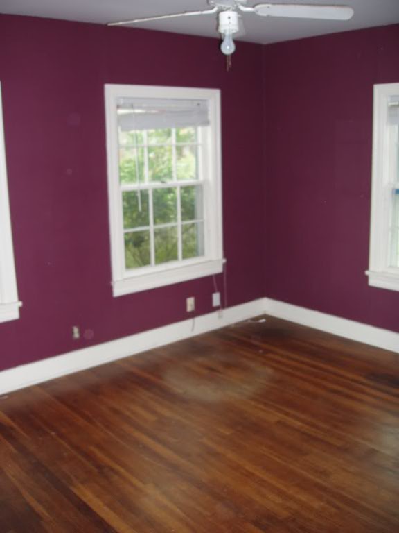 5204 Duval Street Austin, TX 78751 - Photo 4 of 7 a view of an empty room with wooden floor and a window