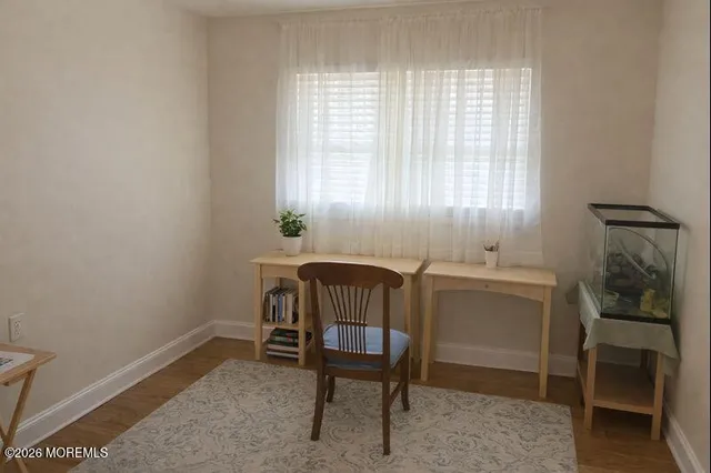 a room with a table and windows