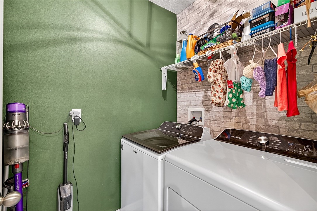 233 Periwinkle Drive Sebastian, FL 32958 - Photo 19 of 34 a utility room with dryer and washer