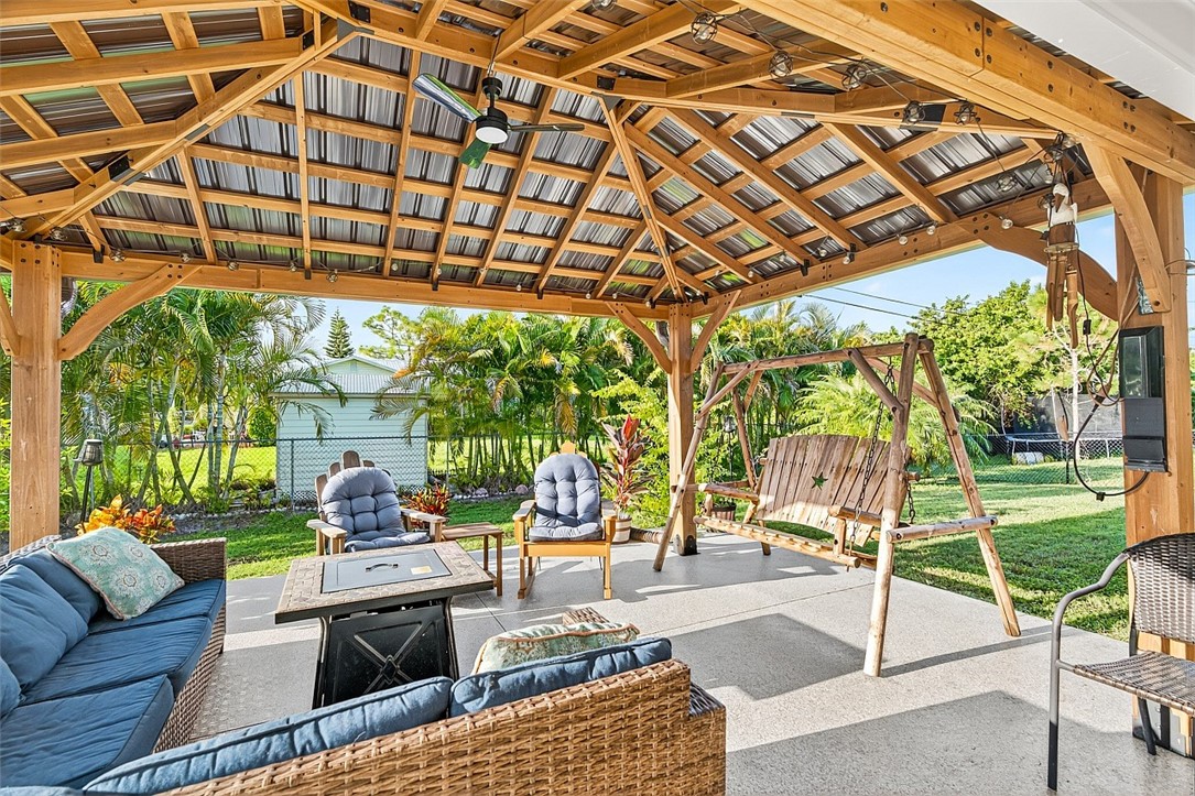 233 Periwinkle Drive Sebastian, FL 32958 - Photo 21 of 34 a outdoor living space with furniture and garden view