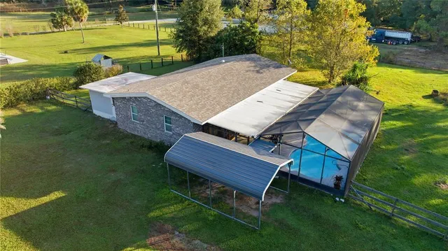 a view of a backyard with sitting area
