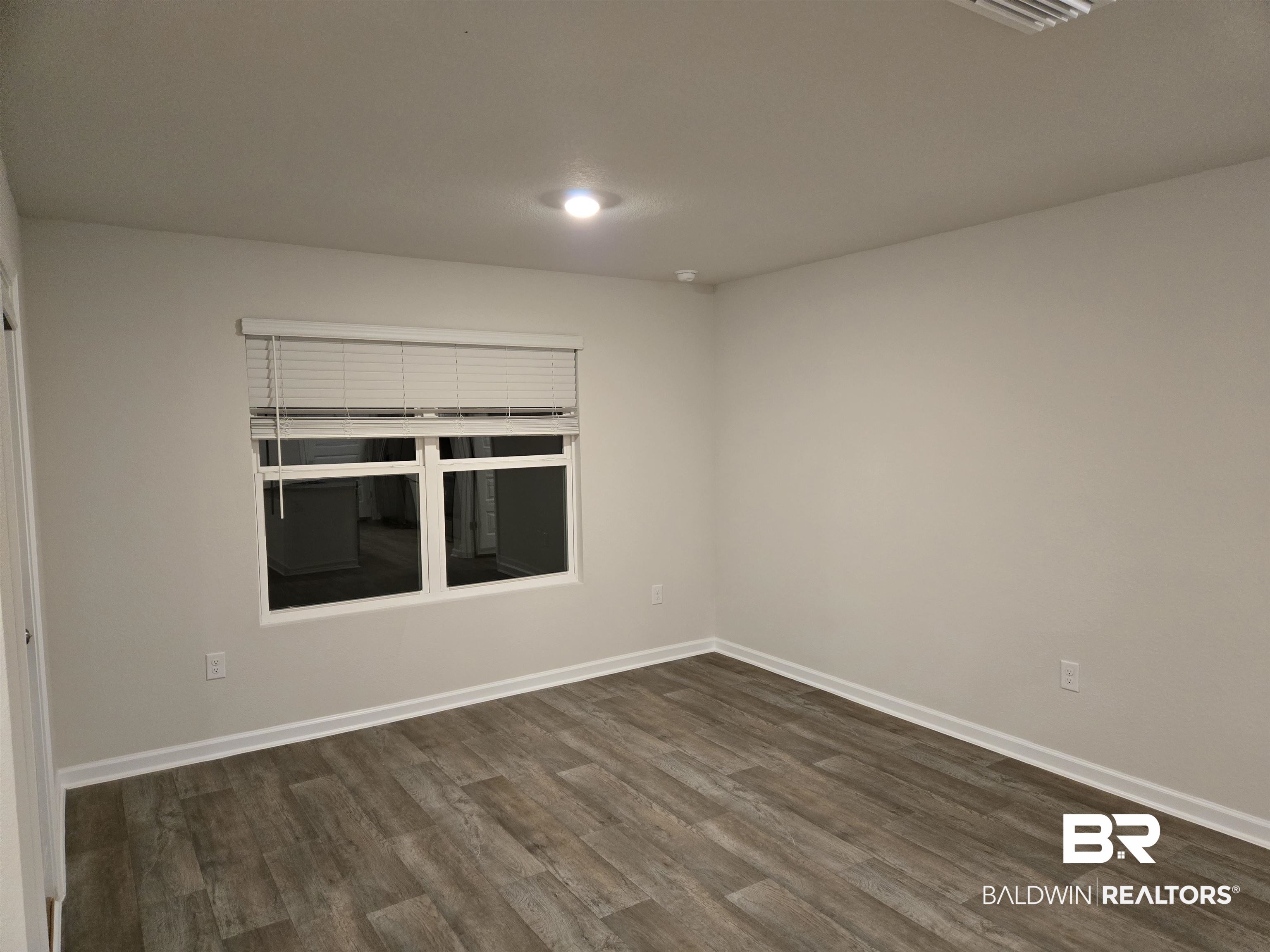 24194 Veranda Circle Elberta, AL 36530 - Photo 17 of 31 Unfurnished room with dark wood-type flooring