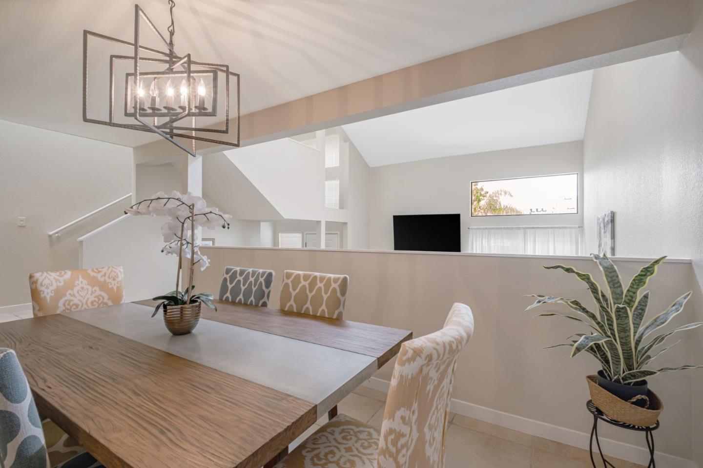 1067 Vía Tornasol Aptos, CA 95003 - Photo 16 of 38 a view of a dining room with furniture and wooden floor