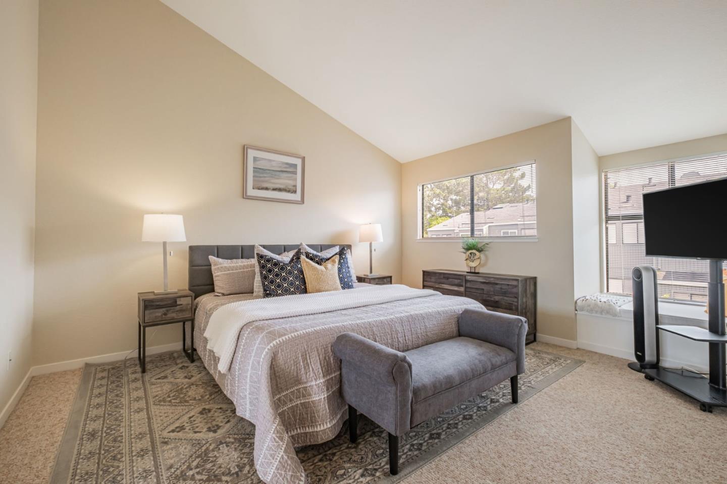 1067 Vía Tornasol Aptos, CA 95003 - Photo 25 of 38 a bedroom with a bed and a flat screen tv