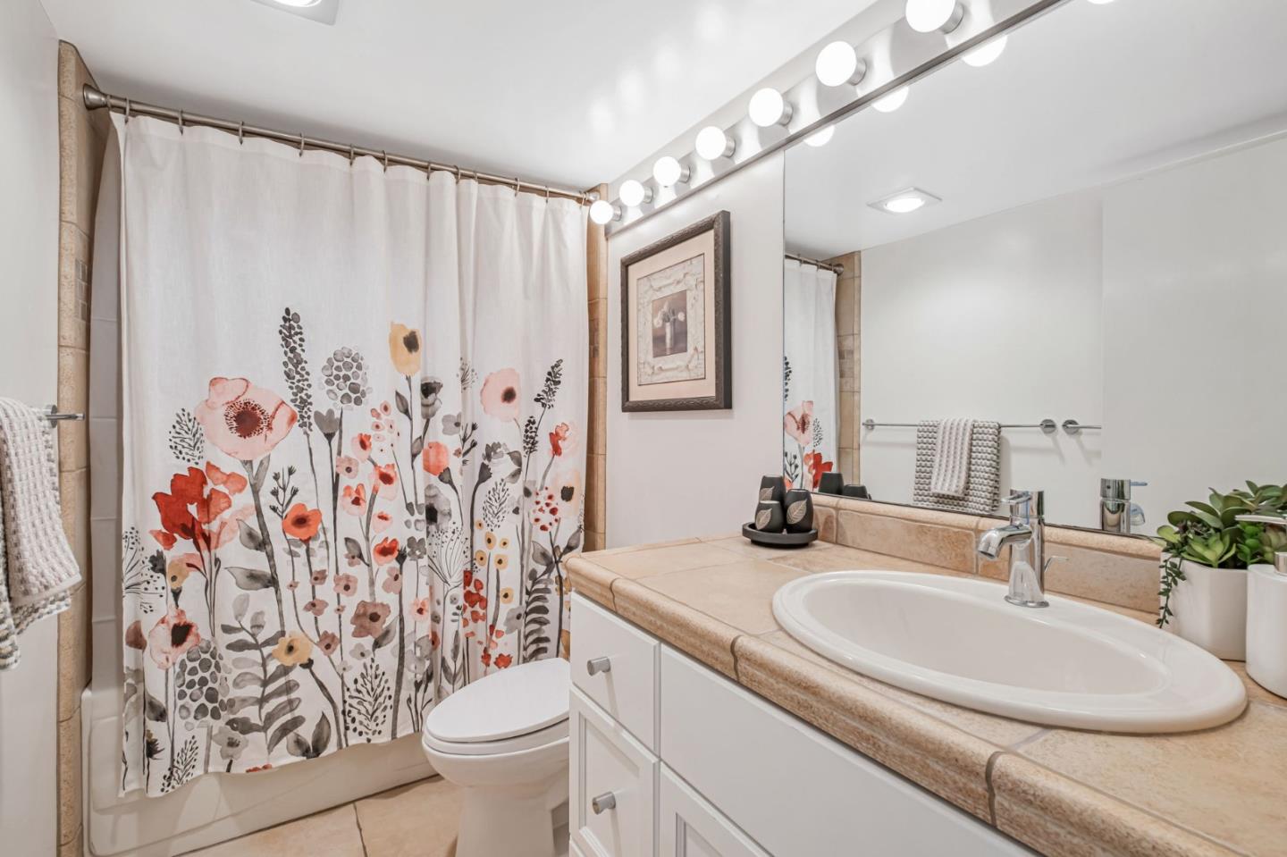 1067 Vía Tornasol Aptos, CA 95003 - Photo 27 of 38 a bathroom with a sink toilet and shower