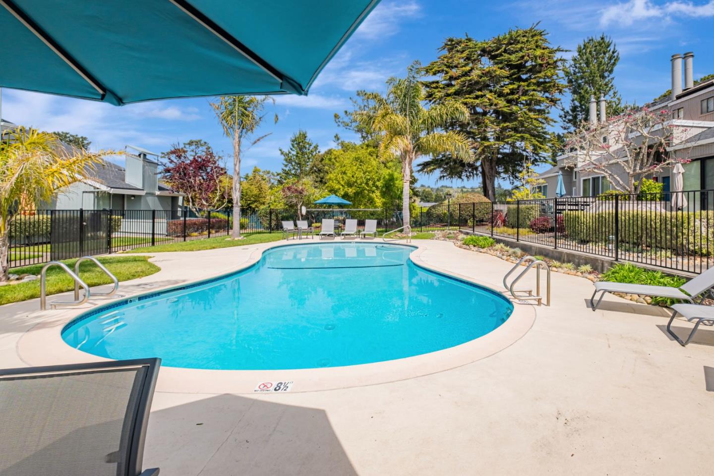 1067 Vía Tornasol Aptos, CA 95003 - Photo 33 of 38 a view of a swimming pool with a patio