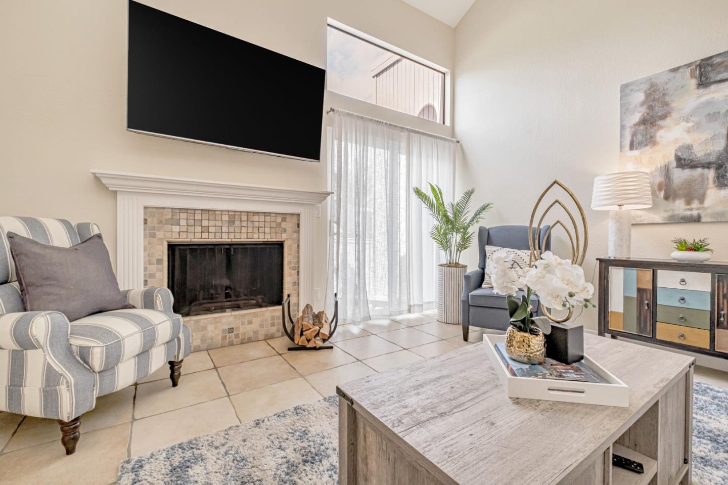 1067 Vía Tornasol Aptos, CA 95003 - Photo 7 of 38 a living room with furniture a flat screen tv and a fireplace