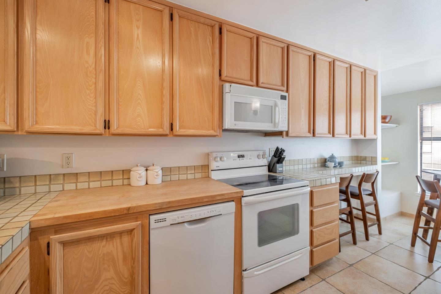 1067 Vía Tornasol Aptos, CA 95003 - Photo 10 of 38 a view of a kitchen with appliances and cabinets