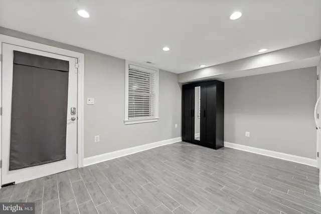 a view of a patio with wooden fence
