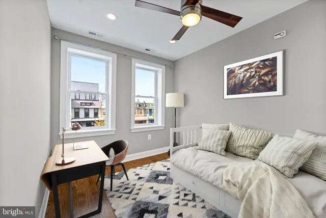 a bedroom with furniture and a window