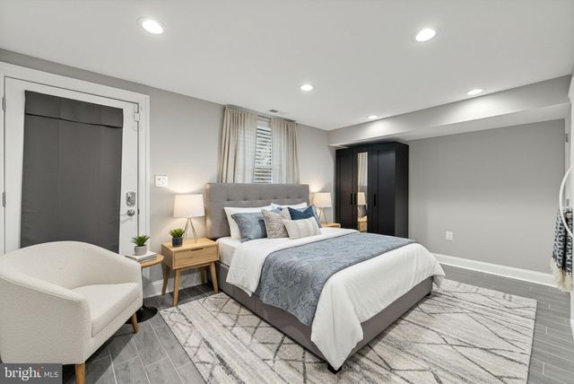 a bedroom with a bed and a couch