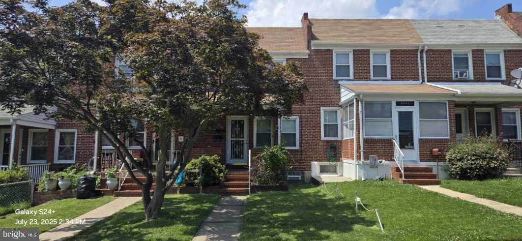 7024 Conley Street Baltimore, MD 21224 - Photo 1 of 20 front view of a house with a yard