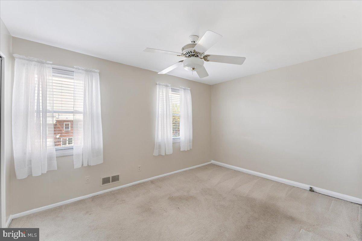 7024 Conley Street Baltimore, MD 21224 - Photo 14 of 20 a view of an empty room with a window