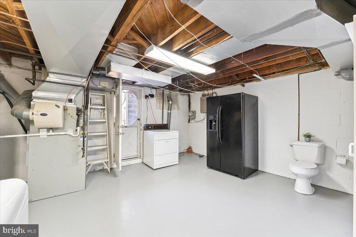 7024 Conley Street Baltimore, MD 21224 - Photo 18 of 20 a utility room with refrigerator and washer