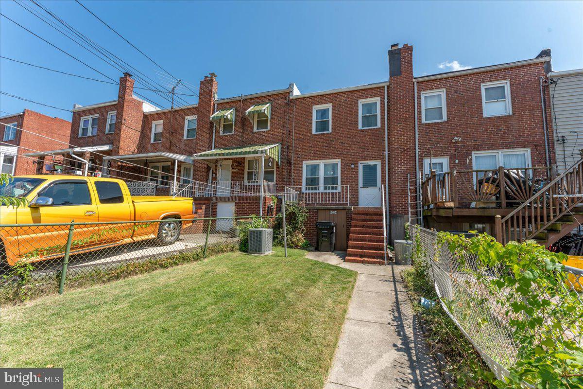 7024 Conley Street Baltimore, MD 21224 - Photo 19 of 20 a view of a house with a swimming pool