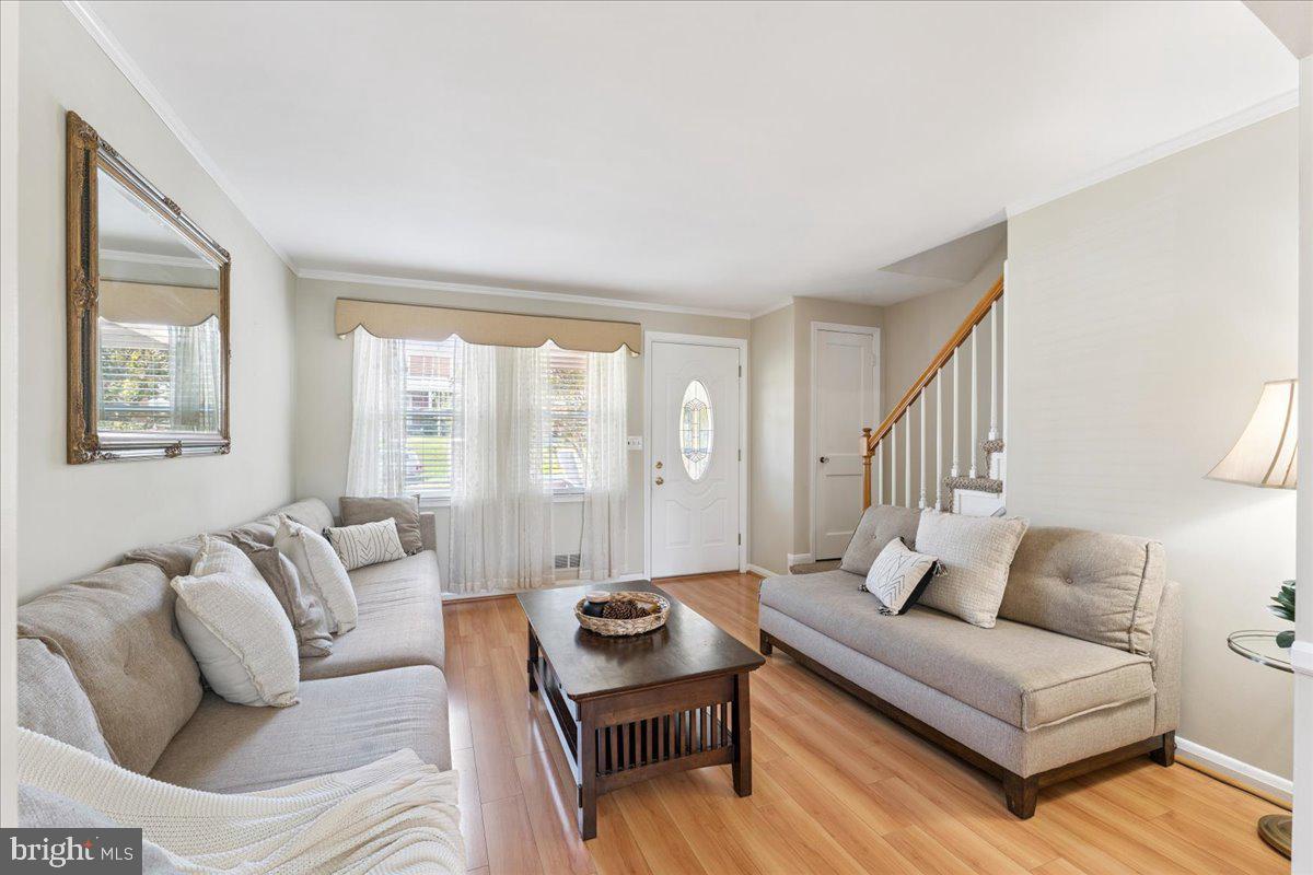 7024 Conley Street Baltimore, MD 21224 - Photo 4 of 20 a living room with furniture and a large window