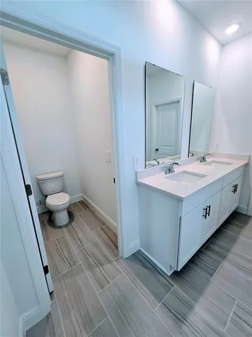 a bathroom with a glass shower door