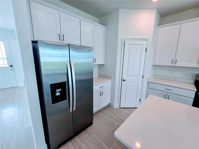 a kitchen with a sink and a stove top oven