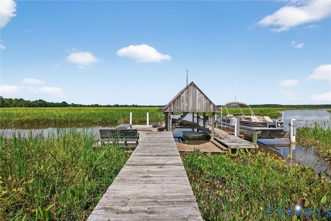 21407 Old Neck Road Charles City, VA 23030 - Photo 17 of 50 a view of a patio with chairs next to a yard
