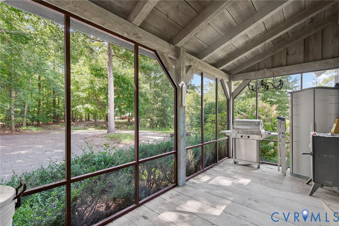 21407 Old Neck Road Charles City, VA 23030 - Photo 22 of 50 a view of a porch with furniture and floor to ceiling window