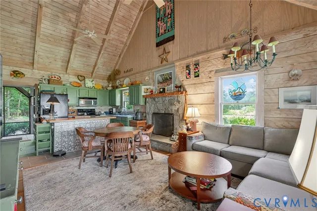 a living room with patio furniture and a fireplace