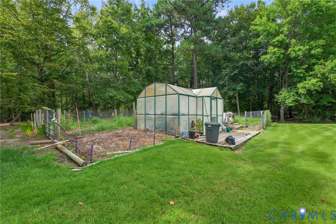 21407 Old Neck Road Charles City, VA 23030 - Photo 39 of 50 a view of a house with backyard and sitting area