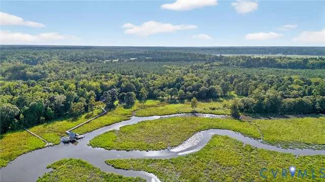 a view of a swimming pool with a yard