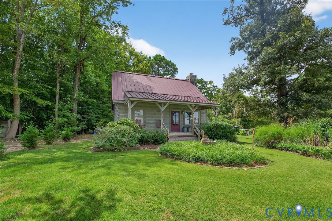 21407 Old Neck Road Charles City, VA 23030 - Photo 45 of 50 a view of a house with a yard