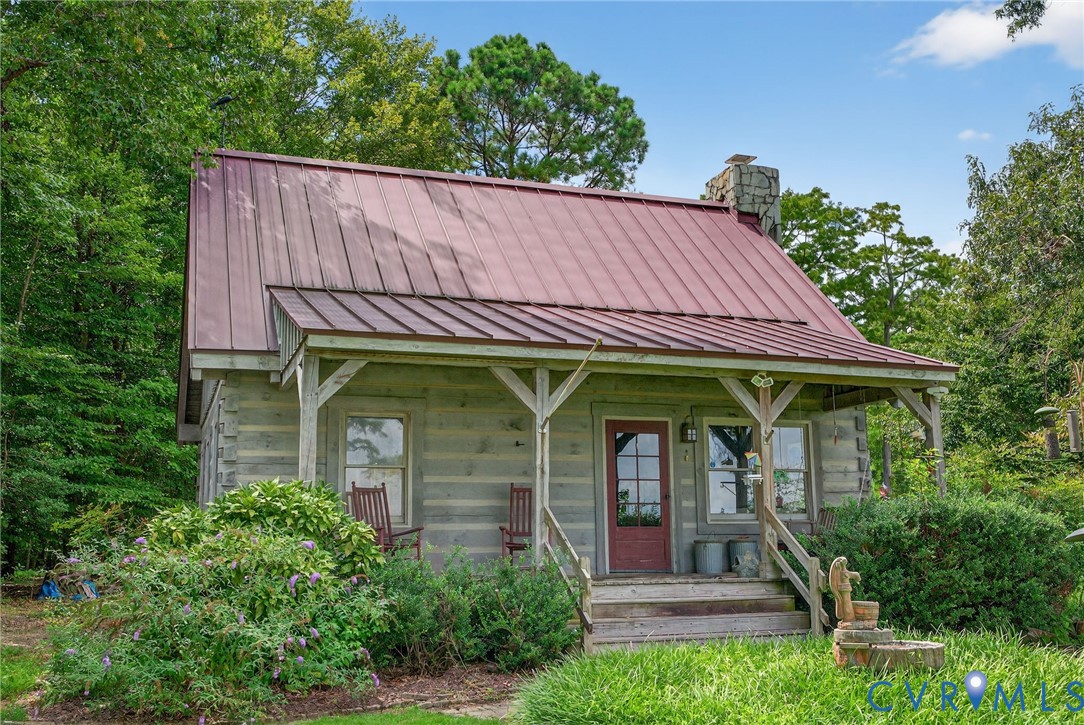 21407 Old Neck Road Charles City, VA 23030 - Photo 46 of 50 a view of a backyard with plants and large trees