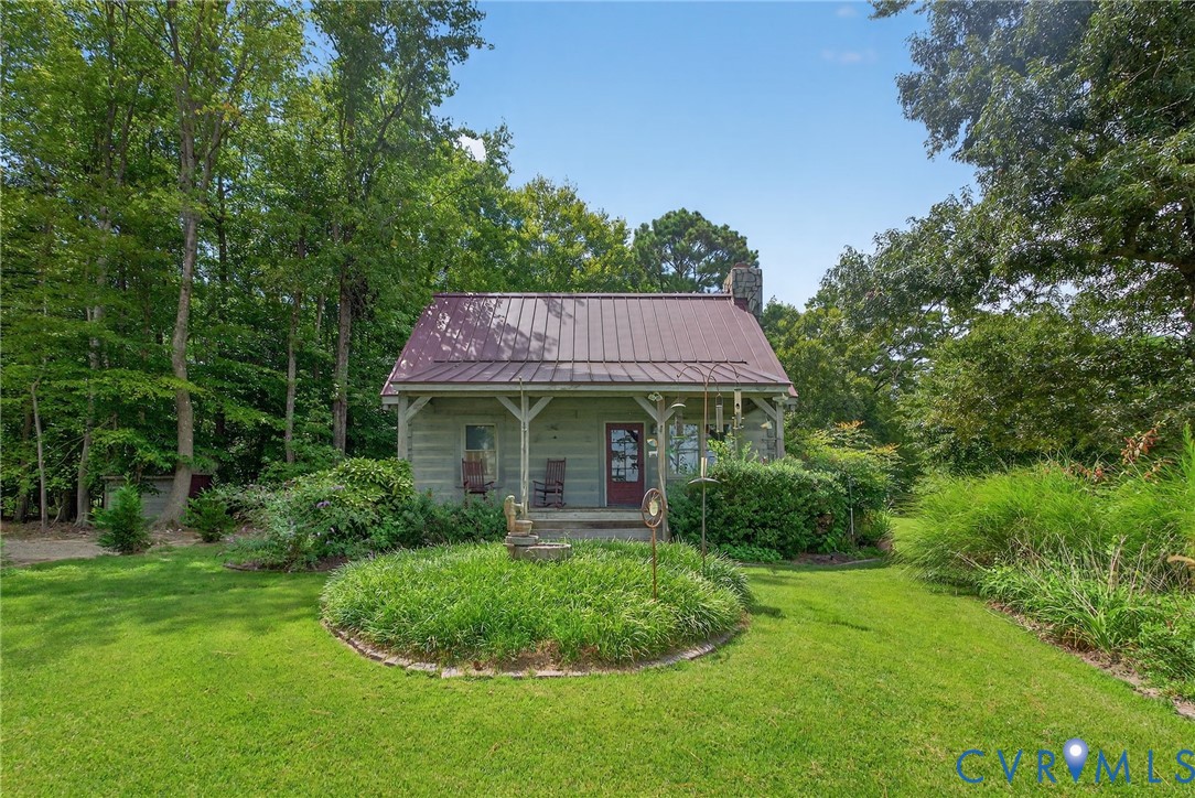 21407 Old Neck Road Charles City, VA 23030 - Photo 47 of 50 a view of a house with a garden