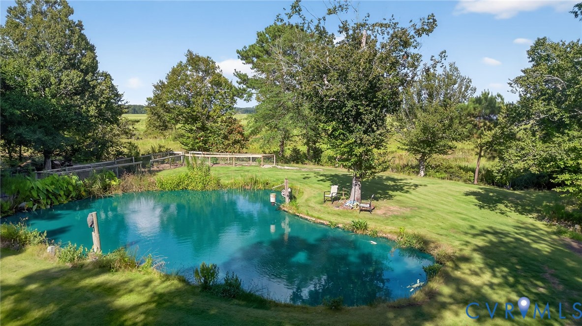 21407 Old Neck Road Charles City, VA 23030 - Photo 9 of 50 a view of a lake view with a garden