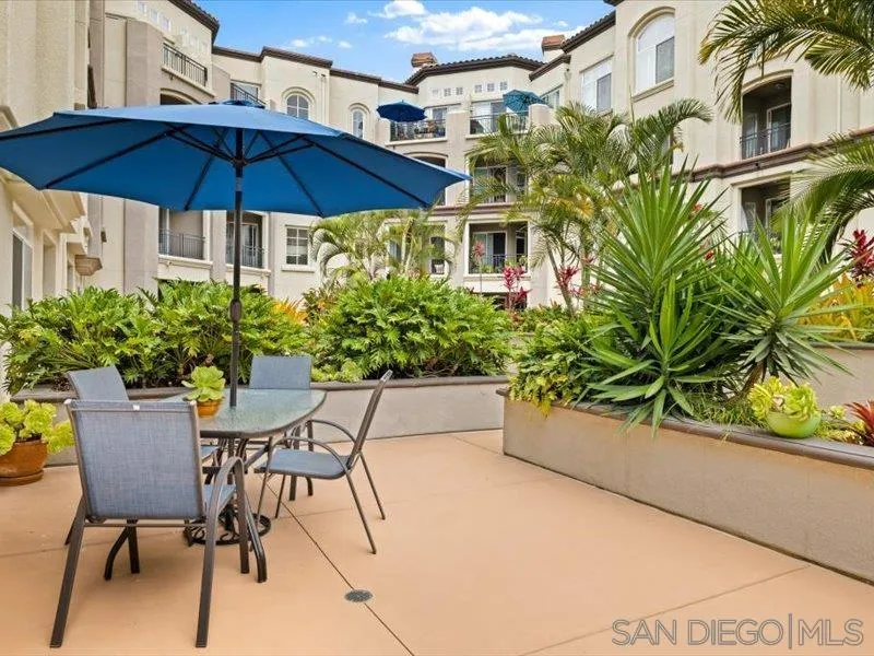 9237 Regents Road, Unit K101 La Jolla, CA 92037 - Photo 14 of 29 a view of a chair and table in the patio with a fire pit