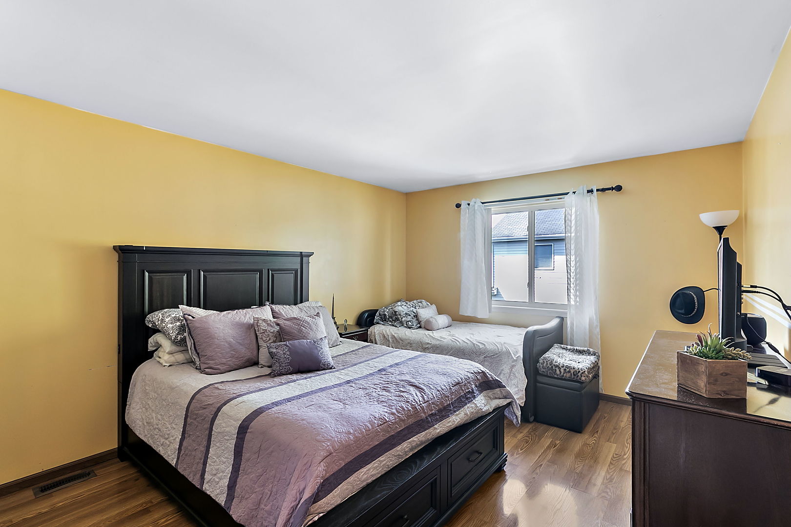 116 Hampton Avenue Westmont, IL 60559 - Photo 11 of 19 a bedroom with a bed and a dresser