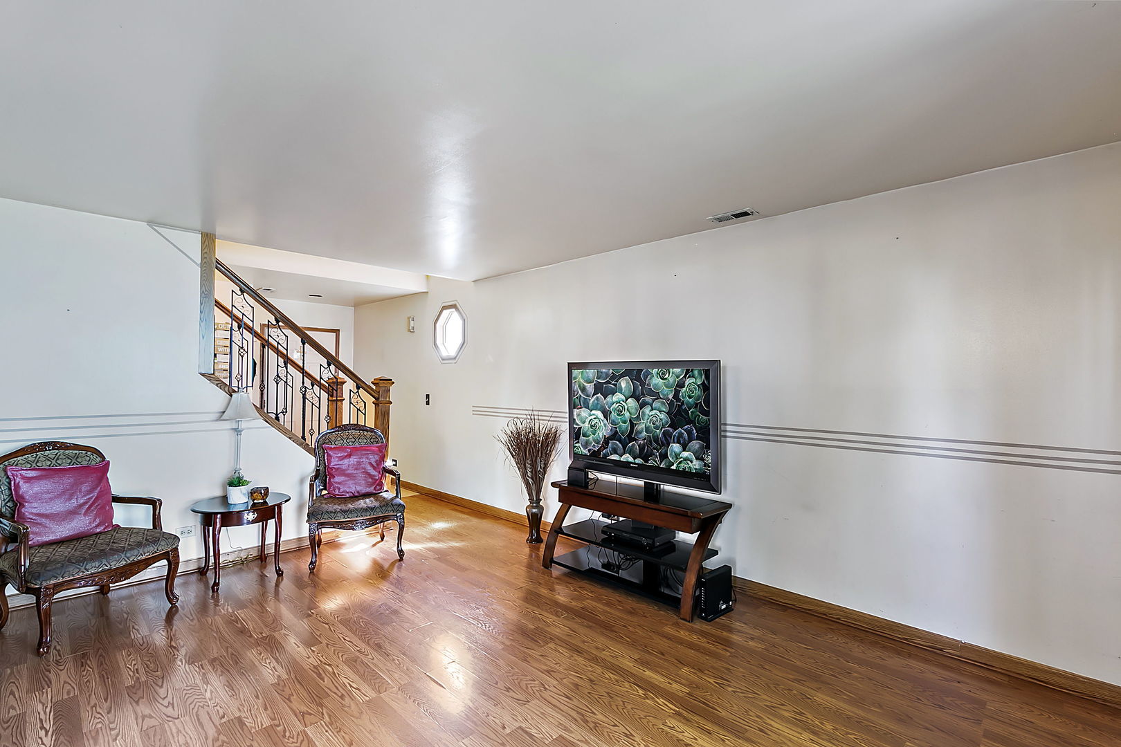 116 Hampton Avenue Westmont, IL 60559 - Photo 3 of 19 a living room with furniture and a wooden floor