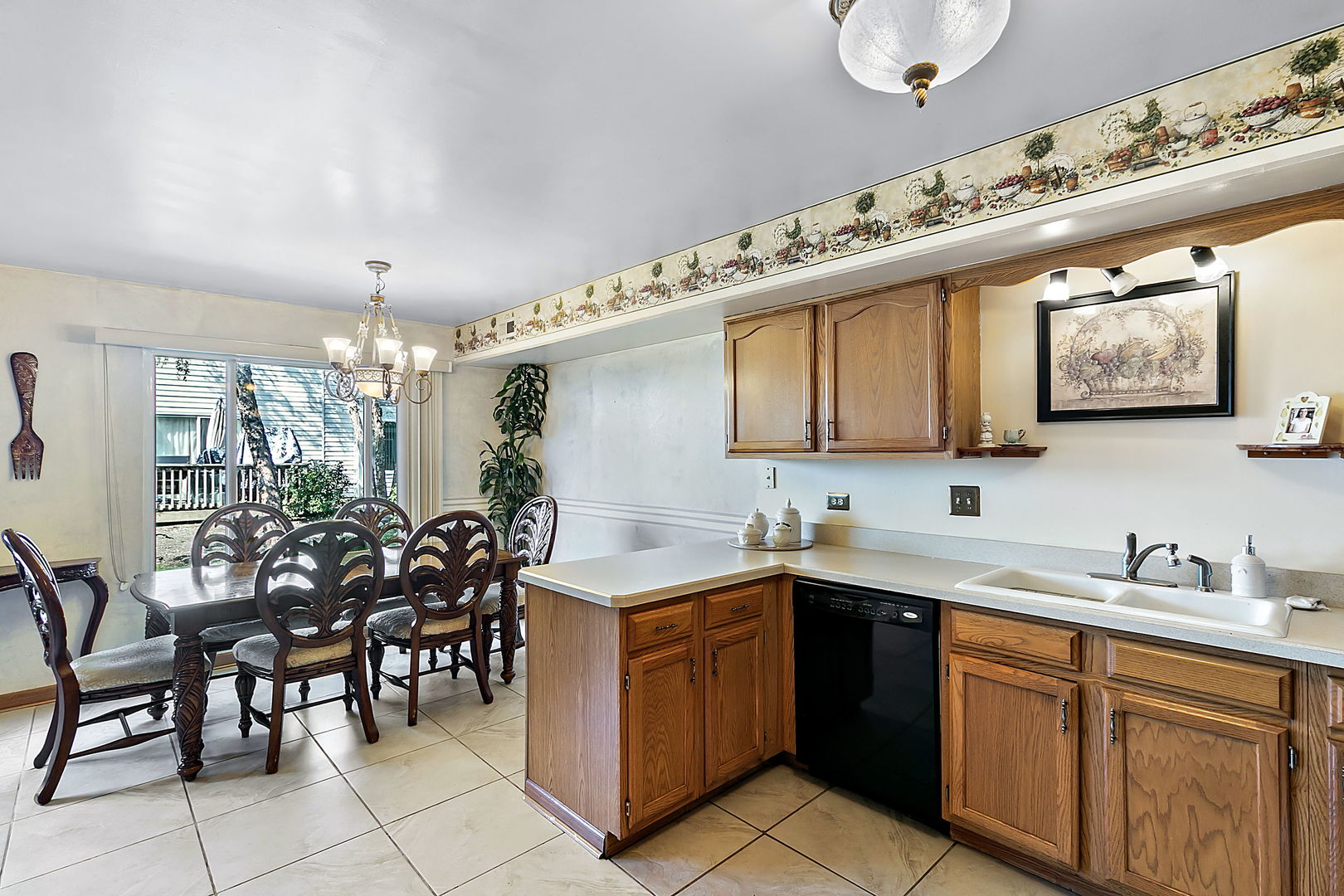 116 Hampton Avenue Westmont, IL 60559 - Photo 6 of 19 a kitchen with a sink a counter space appliances and cabinets