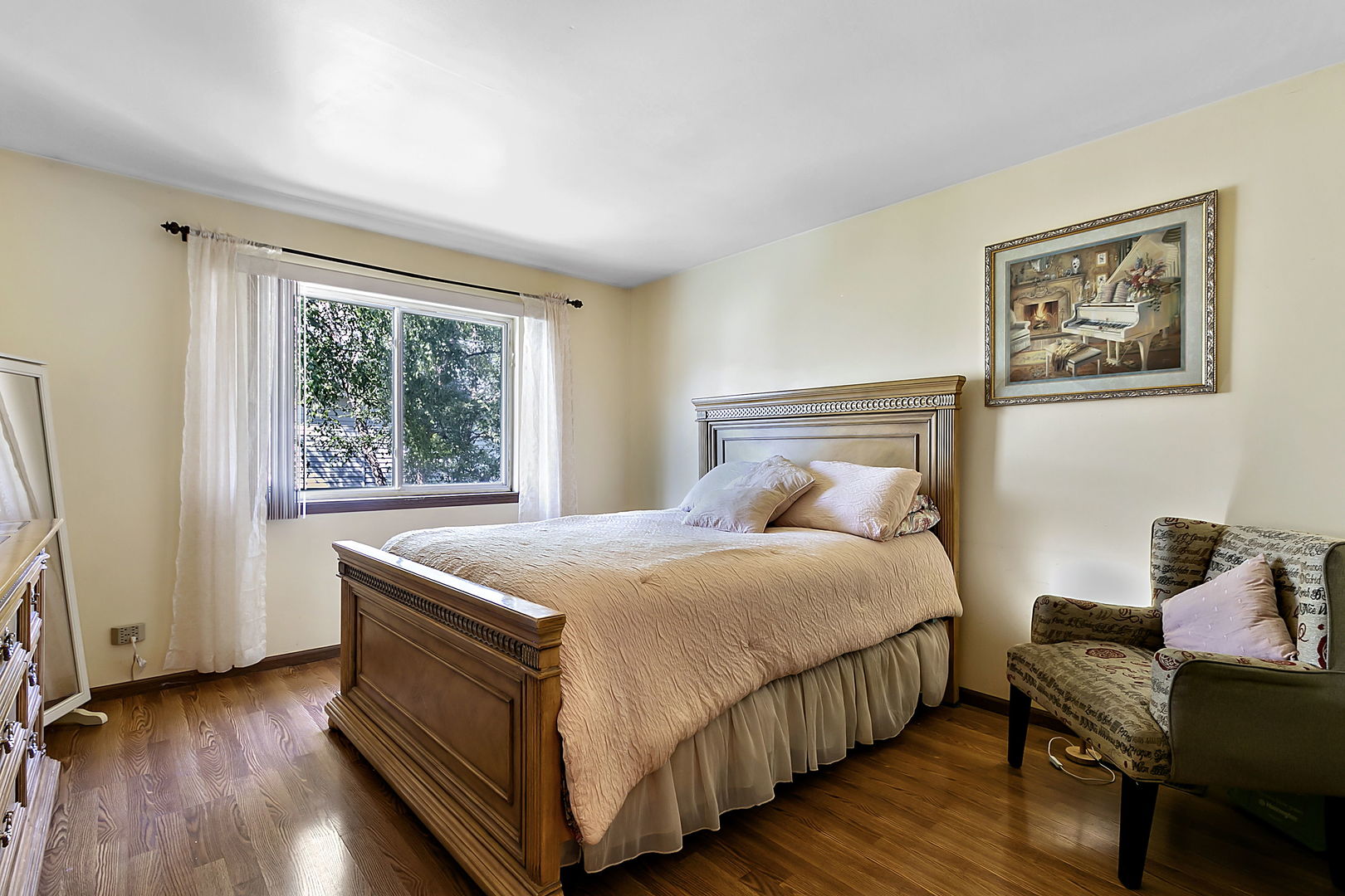 116 Hampton Avenue Westmont, IL 60559 - Photo 9 of 19 a bedroom with a bed and wooden floor
