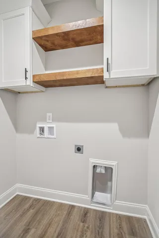 a view of a room with a ceiling fan